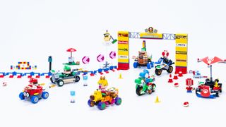 Lego Mario Kart sets on a plain background, surrounded by accessories and a course