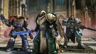 Three Space Marines standing together with different guns in Warhammer 40,000: Space Marine 2