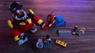 Lego Sonic vs. Dr. Eggman's Death Egg Robot set, fully constructed and laid out on a wooden surface