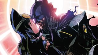 Batman and Catwoman kiss.